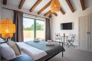 a bedroom with a bed and a large window at Villa Kaia in Kringa +34 photos