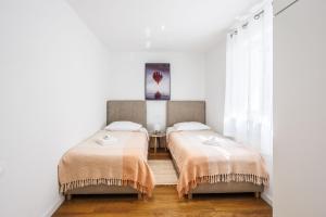 Postel nebo postele na pokoji v ubytování Villa Hippus + 37 fotografií