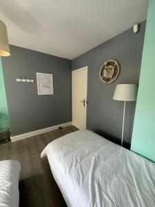 Postel nebo postele na pokoji v ubytování Spacieuse et agréable à séjourner