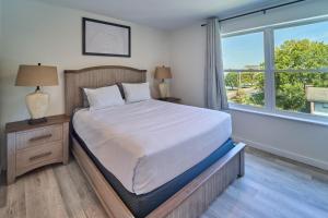 a bedroom with a bed and a large window at The Ruby 301 By Avada Properties in Pigeon Forge
