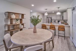 a kitchen and dining room with a table and chairs at The Ruby 301 By Avada Properties in Pigeon Forge