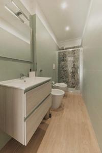 Koupelna v ubytování Nicuzza Apartment + 7 fotografií