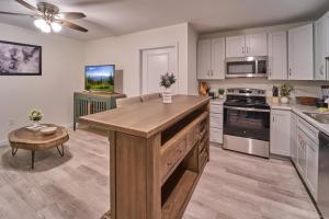 a kitchen with a large wooden island in a room at The Ruby 303 By Avada Properties in Pigeon Forge