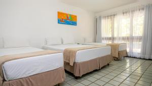 Katil atau katil-katil dalam bilik di Porto Seguro Praia Resort - All Inclusive +43 gambar