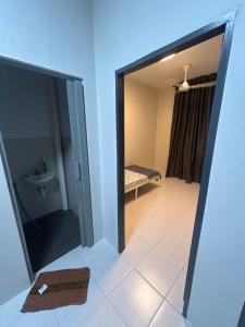 Ένα ή περισσότερα κρεβάτια σε δωμάτιο στο Daus&iqah Homestay Jasin Mlk +11 φωτογραφίες