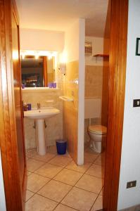 a bathroom with a sink and a toilet at Case Gran Paradiso Rhemes Saint Georges Vieux in Rhemes-Saint-Georges