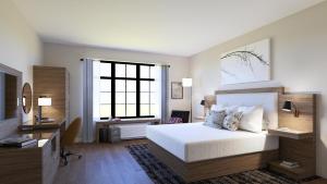 a bedroom with a bed and a large window at Hotel Rose in Rockford