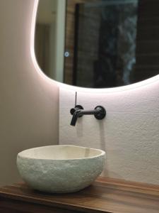 a bowl sink on a counter under a mirror at L instant précieux in Marseille