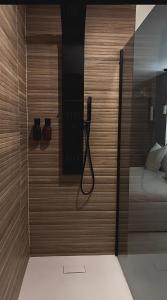 a room with a phone on a wall next to a bed at L instant précieux in Marseille