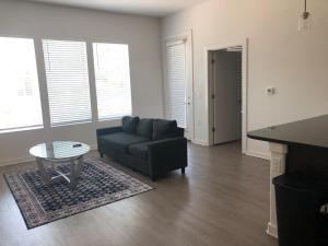 a living room with a couch and a table at Modern Leander Getaway Near Shop- Leander TX in Leander +12 photos