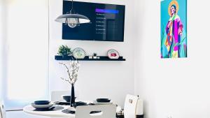 TV a/nebo společenská místnost v ubytování Apartamentos la Cárcava