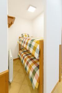 a bedroom with a bunk bed in a room at The Capriolo home in Tarvisio +2 photos