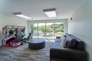 a living room with a couch and a table at The Ruby 310 By Avada Properties in Pigeon Forge