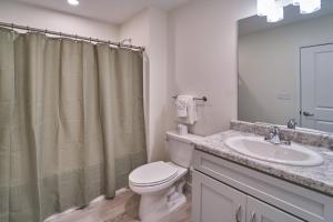 a bathroom with a toilet and a sink at The Ruby 311 By Avada Properties in Pigeon Forge