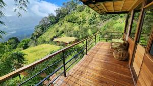 a balcony of a house with a view of a mountain at Cloud Forest Lodge Boquete in Bajo Boquete