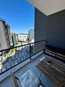 a balcony with a bench on top of a building at Apartment - Vucica in Bjelašnica +44 photos