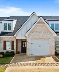 a house with a garage at Farmville Lakes Tailored Townhouse in Auburn
