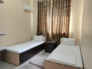 Ένα ή περισσότερα κρεβάτια σε δωμάτιο στο Гостиница Шатыр +27 φωτογραφίες