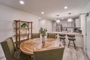 a kitchen and dining room with a wooden table and chairs at The Ruby 314 By Avada Properties in Pigeon Forge