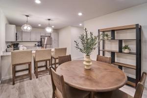 a kitchen and dining room with a wooden table and chairs at The Ruby 315 By Avada Properties in Pigeon Forge