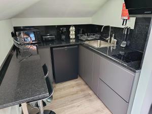 a kitchen with a sink and a counter top at Rose house in Ribeira Brava