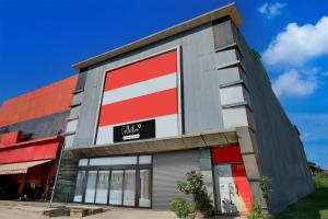 a building with a red and white sign on it at Collection O Singha Crossway Formerly Hotel Star Key in Gurgaon