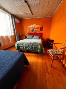 Postel nebo postele na pokoji v ubytování HOSTAL VALDIVIA