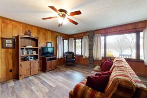 a living room with a couch and a ceiling fan at Morris Villa Lower in Lake Junaluska