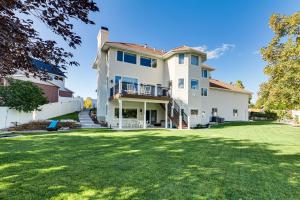 a large white house with a large yard at Under the Sea and Ski Apt with View, Near Dwtn in Salt Lake City