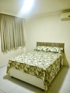 Postel nebo postele na pokoji v ubytování Temporada Apto Litoral Sul - Praia de Jacumã + 26 fotografií