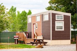 a tiny house with a picnic table and a picnic table at JW Grand Junction in Grand Junction +14 photos