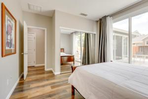 a bedroom with a bed and a large window at Quiet and Convenient! Santa Rosa Family Home with Yard in Fulton