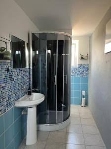 a bathroom with a sink and a shower at Chalupa na vesnici - Blansko in Chrudim