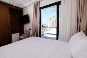 Postel nebo postele na pokoji v ubytování Chic Hotel