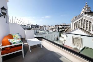 a balcony with a view of a city at Chic Hotel in Rabat