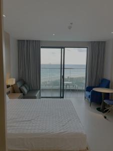 Voodi või voodid majutusasutuse The Arena Resort Beach Front View toas