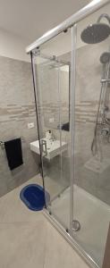 a bathroom with a sink and a mirror at Short Location Paratore Casa Melina in Catania +29 photos