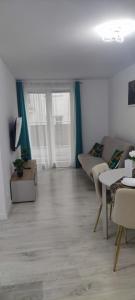 TV a/nebo společenská místnost v ubytování Kapi Royal Apartament