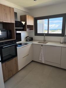 Kuchyň nebo kuchyňský kout v ubytování Appartement Azura + 4 fotografie