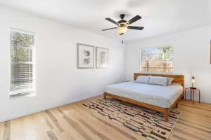 a bedroom with a bed and a ceiling fan at Pet Friendly Crystal River Retreat for the Family in Crystal River +28 photos