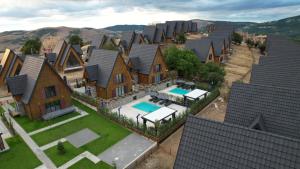 an aerial view of a house with a swimming pool at Casa Brava villas in Novoberdo