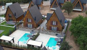 an aerial view of a house with two swimming pools at Casa Brava villas in Novoberdo +4 photos