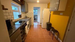 a kitchen with a sink and a stove top oven at Saint Paul 01 in Bristol