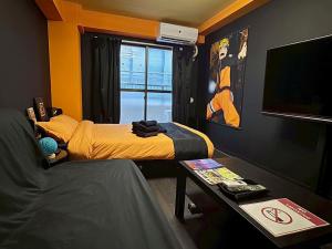 a small room with two beds and a table at Dai2 Narumitsu Building 301 - Vacation STAY 29234v in Tokyo