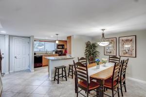 a kitchen and dining room with a table and chairs at Stones Throw 30 in Hilton Head Island