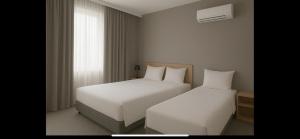 Postel nebo postele na pokoji v ubytování Hotel Catarina