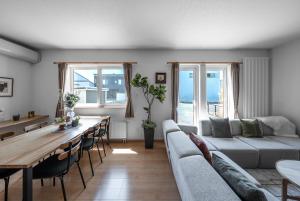 a living room with a couch and a table at THE VERTEX - Vacation STAY 20147 in Shin-asahigawa