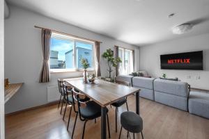 a living room with a table and a couch at THE VERTEX - Vacation STAY 20147 in Shin-asahigawa