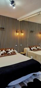 Ένα ή περισσότερα κρεβάτια σε δωμάτιο στο Junior Suites con Jacuzzi