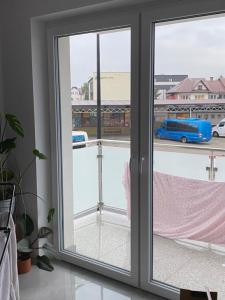 a sliding glass door with a view of a street at Domek w Biłgoraju in Biłgoraj